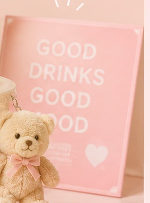 A pink sign reading Good Drinks Good Mood